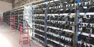 A large-scale mining farm showcasing rows of mining machines, emphasizing the industrial scale of cryptocurrency mining operations.